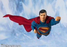Load image into Gallery viewer, Superman action figure in flight against a snowy mountain background
